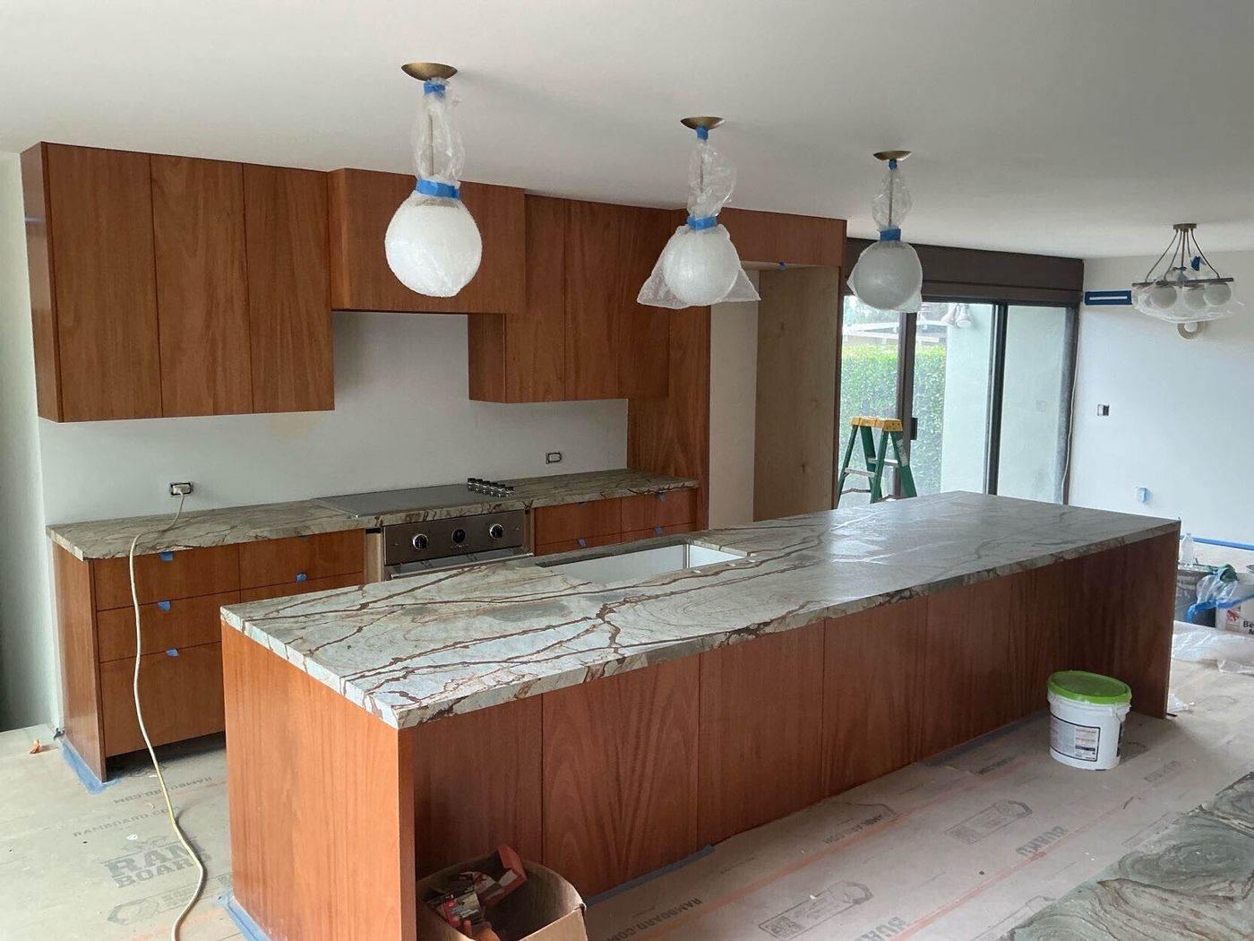Custom kitchen with quartzite island and mahogany casework